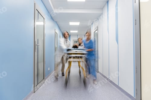 Preview: Group of doctors transportating patient on gurney