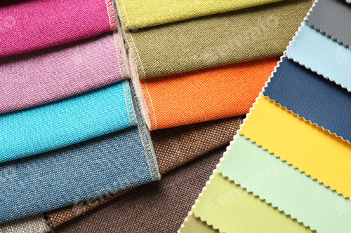 Preview: Samples of different fabrics as background, closeup