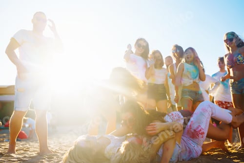 Preview: Group of friends have fun, dance at holi festival. Celebrating indian spring holiday. Friendship