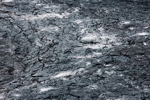Preview: Close up cooled black volcanic rock, with ash grey patches on the surface - Iceland