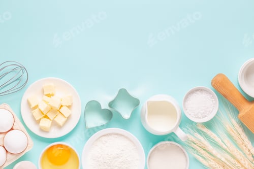 Preview: Ingredients for baking on light blue background.