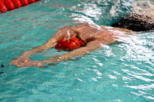 Preview: Keeping fit swim training indoors, swimming in lanes in indoor pool. Fitness, strength and stamina.
