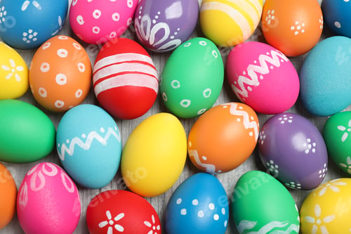 Preview: Many bright Easter eggs on wooden background, top view