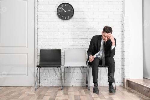 Preview: Young man waiting for job interview, indoors