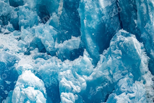 Preview: Closeup shot of the ice texture of a blue glacial wall in Inside Passage, Alaska