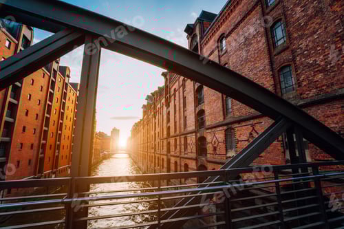 Preview: The red brick warehouse - Speicherstadt district in Hamburg Germany, framed by steel bridge arch