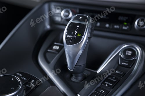 Preview: Closeup shot of the automatic gear stick of a modern sport car