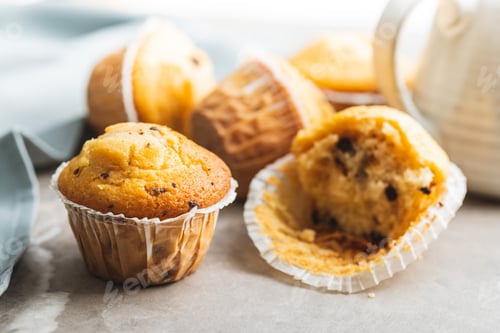 Preview: Sweet vanilla muffins on kitchen table.