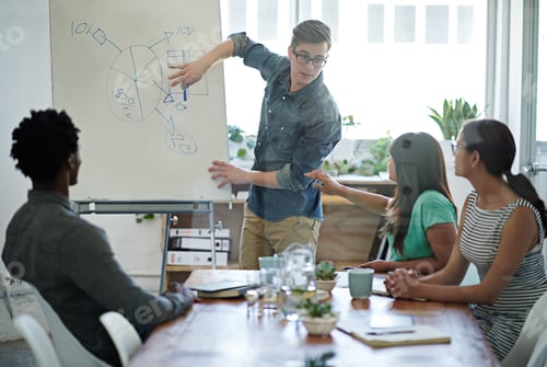 Preview: Charting their successes. Shot of a group of coworkers in a boardroom meeting.