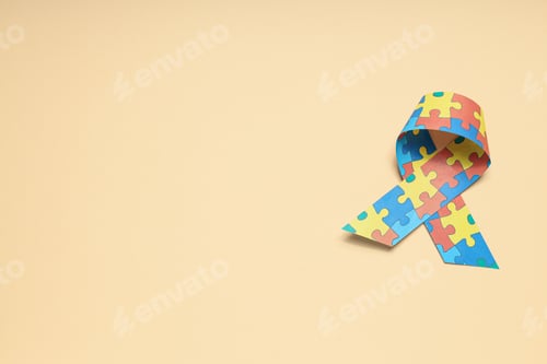 Preview: Ribbon with multi-colored puzzle pieces on a light background, place for text