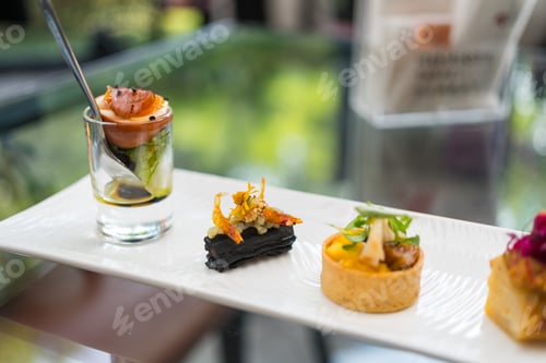 Preview: Elegant gourmet appetizer platter fine dining presentation in restaurant
