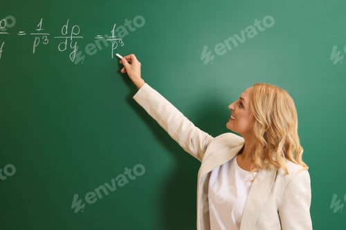 Preview: Professor writing down math equation on green board