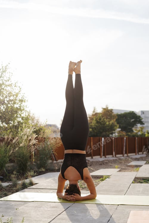 Preview: Young girl practicing stretching and yoga workout exercise