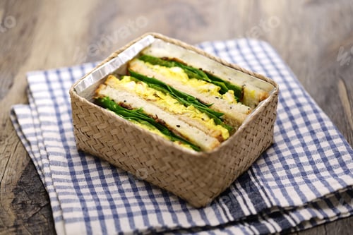 Preview: homemade coronation chicken sandwich in lunch box, British cuisine