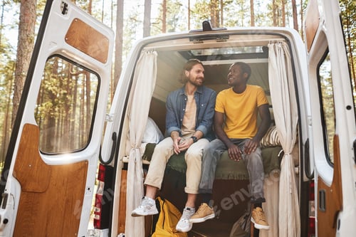 Preview: Guys resting in motorhome at camping