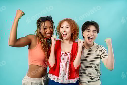 Preview: Portrait of diverse Generation Z friends posing on isolated blue screen.