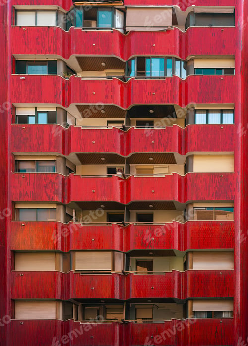 Preview: Bold Red Facade of Urban Apartment Building