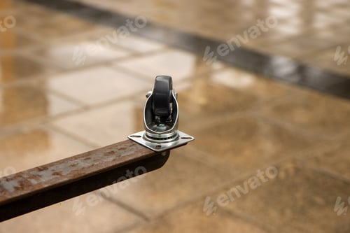 Preview: A Metal Caster On A Metal Table Leg