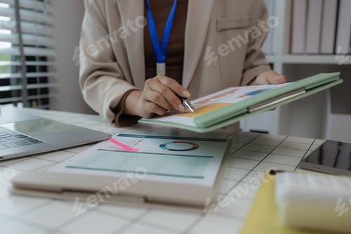 Preview: a businesswoman is sitting in her private office working on her desk