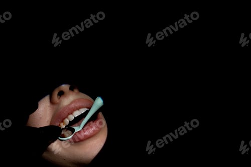 Preview: Dentistry a dentist examines a patient's teeth