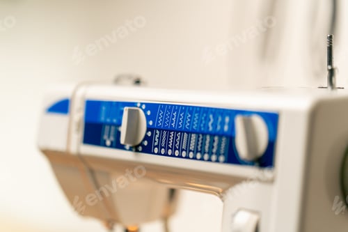 Preview: close-up in a sewing workshop on machine showing possible stitch patterns