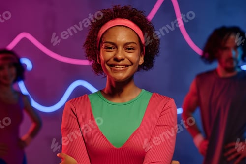 Preview: Young Woman in Retro Attire Posing at Fitness Club