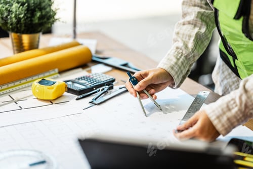 Preview: Female architect engineer is drafting blueprints using CAD software, focusing on sustainable