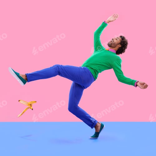 Preview: Humorous shot of a young man slipping on a banana peel agains a colorful studio background