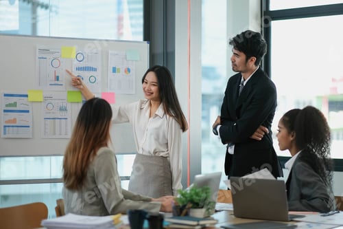Preview: Female Operations Manager Holds Meeting Presentation for a Team of Economists. Asian Woman Uses Digi