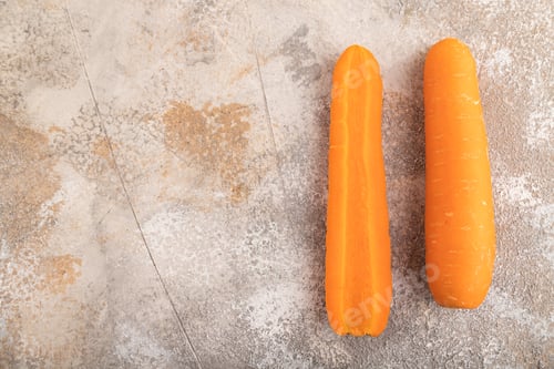 Preview: Orange Carrot on brown concrete, Top view, copy space