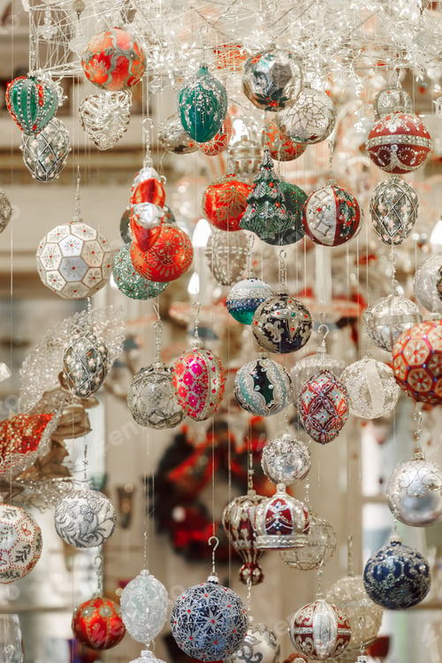 Preview: Showcase with glitter christmas balls hanging by the window case