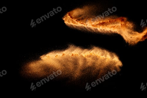 Preview: Sand explosion isolated on black background. Freeze motion of sandy dust splash.
