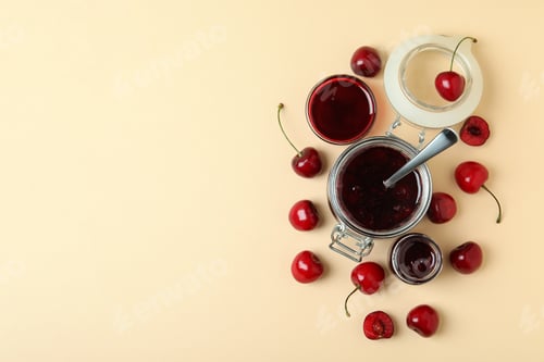 Preview: Cherry jam and ingredients on beige background