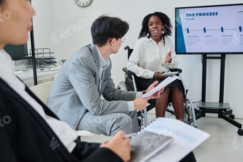 Preview: Businesswoman with disability presenting her report