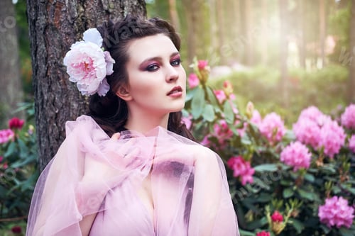 Preview: girl in dress in rhododendron garden