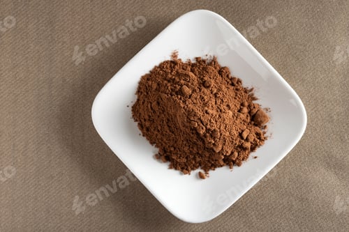 Preview: Cacao. Pile of cocoa powder in plate