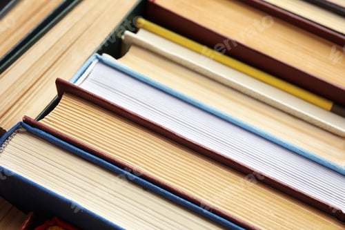 Preview: Many different hardcover books as background, closeup