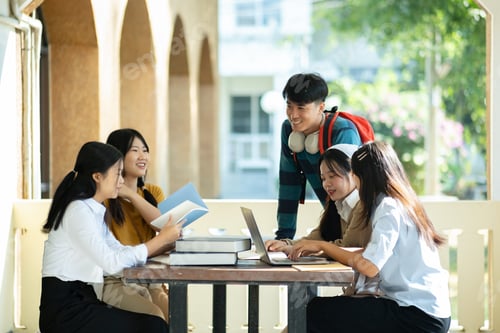 Preview: Group of students studying on campus outdoors