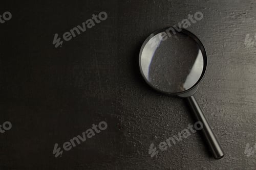 Preview: Loupe or magnifier on a black background. Copy space. Search concept