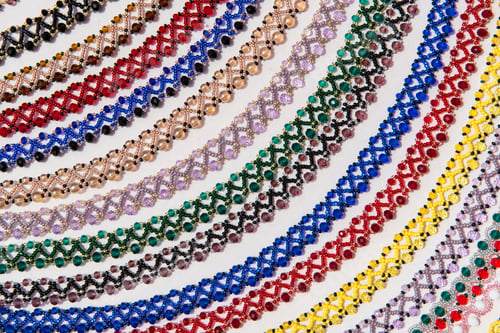 Preview: Background of colorful beaded necklaces made with traditional Romanian glass bead