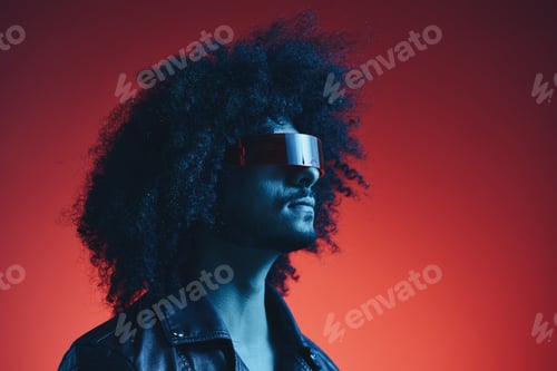 Preview: Portrait of fashion man with curly hair on red background with stylish glasses, multicultural