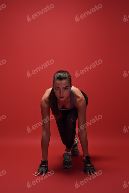 Preview: Ready steady go Attractive young sportswoman is ready to run