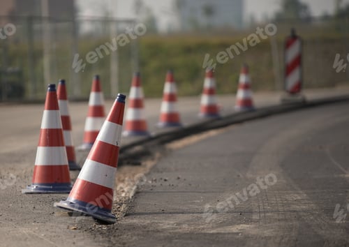 Preview: Red and white roadblocks next to each other during daytime