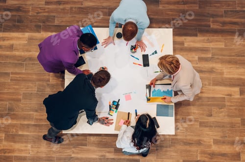 Preview: High angle of a multiracial business people having a meeting in an office