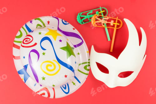 Preview: Top view of colorful Purim holiday items on a red background