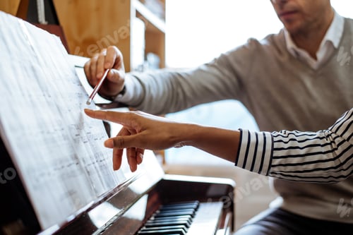 Preview: Woman learning to play piano