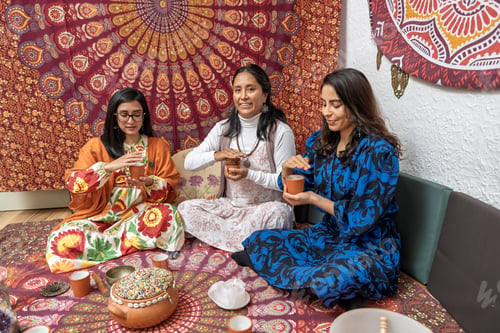 Preview: Women enjoying organic cocoa ceremony for alternative medicine and healthy living
