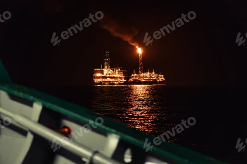 Preview: Night view of FPSO tanker vessel near Oil Rig