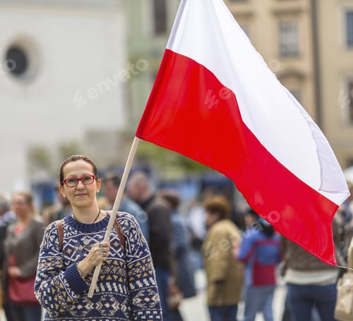 Preview: Young Woman On The Street Holding A Polish Flag.