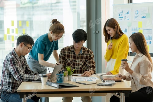 Preview: Group of young Asian business people meeting in casual wear working together on new project.